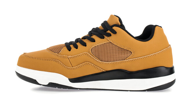 A brown sneaker isolated on a white background.