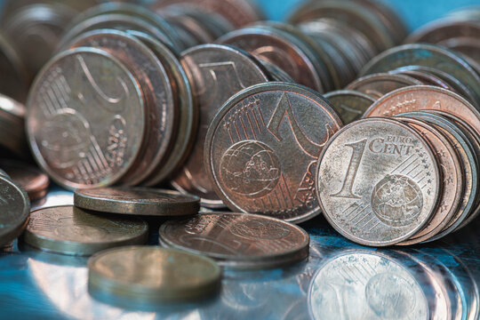 Rows of small cent coins covered with patina. Surface degradation and material aging in non ferrous metals