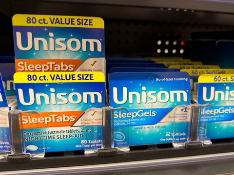 Frisco, Texas, USA - August 31th, 2026: value size doxylamine succinate Unisom SleepTabs night sleep aid blue boxes on Walmart pharmacy display
