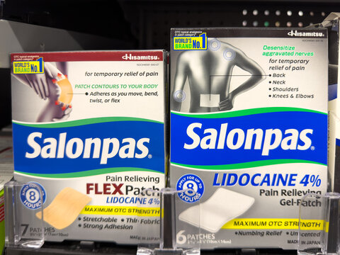 Frisco, Texas, USA - August 31th, 2026: Salonpas lidocaine patch boxes standing on Walmart pharmacy shelf