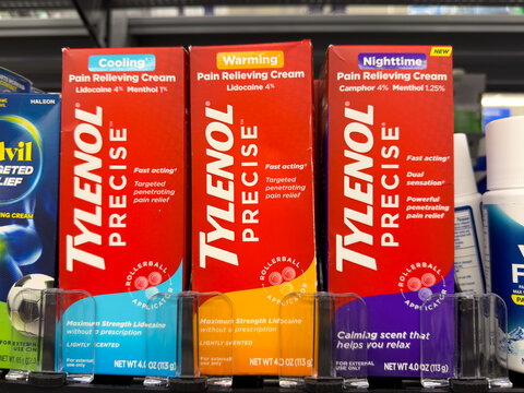 Frisco, Texas, USA - August 31th, 2026: Tylenol Precise pain relieving cream boxes in red and orange packaging standing on Walmart pharmacy shelf