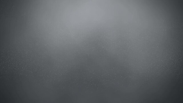 Dust particles floating over dark gray background texture loop