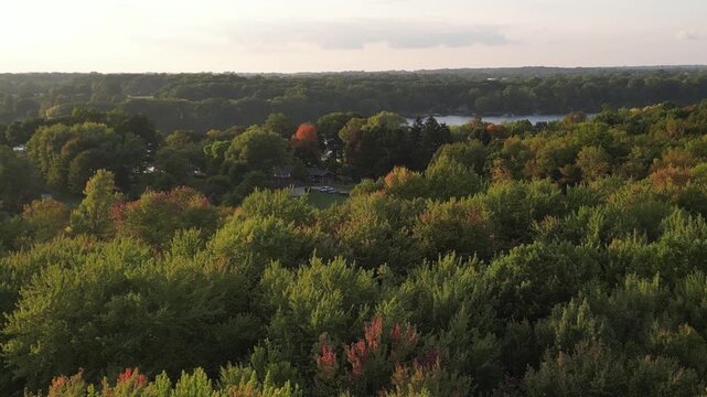 Aerial over Berrien Springs, Oronoko Charter Township, Michigan, United States. A rural community with farms and lakeside / riverside homes. Lake Chapin along the St. Joseph's River.