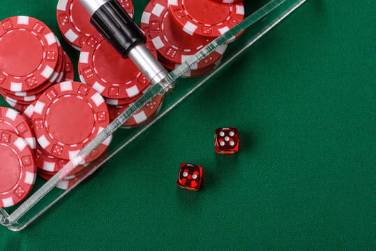 Dice and chips on a green felt gaming table, a poker game in a casino. Casino dice