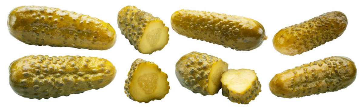 Group of pickled cucumbers and slices on a white background. The file contains a clipping paths.