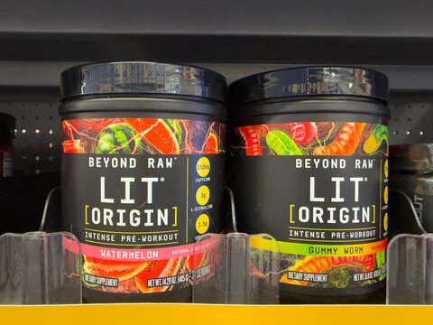 Frisco, Texas, USA - August 31th, 2026: Beyond Raw Lit Origin intense pre-workout dietary supplement powder black plastic tubs standing on Walmart pharmacy shelf