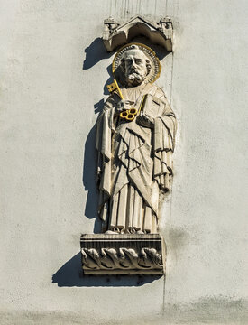 Trier, Germany, Europe - July 25, 2026: Statue of Saint Peter carrying the key. It is set on facade of building at the start of Petrusstrasse, Petrus street. He is the Patron Saint of Trier.