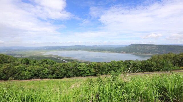 A scenic video view from the high-altitude wind turbine viewpoint at Khao Yai Thiang, Korat, Thailand, featuring beautiful scenery that overlooks the Lam Takhong Dam and wind energy infrastructure.