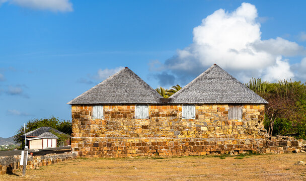 Historic stone buildings with pyramid roofs at Dows Hill in English Harbour, Antigua and Barbuda, the Caribbean