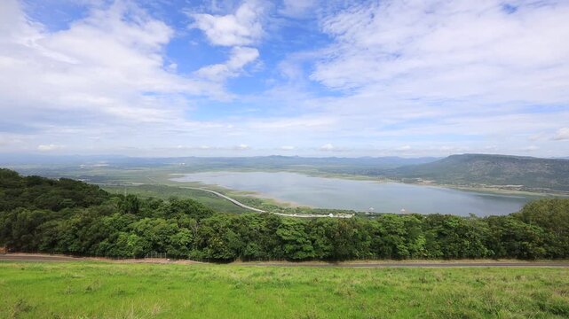 A scenic video view from the high-altitude wind turbine viewpoint at Khao Yai Thiang, Korat, Thailand, featuring beautiful scenery that overlooks the Lam Takhong Dam and wind energy infrastructure.