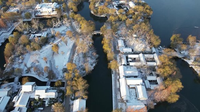 Aerial View of Snowy Traditional Waterfront Park in Jinan, Shandong, China in Winter