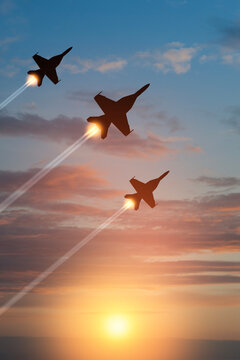 Air Force Day. Aircraft silhouettes on background of sunset. Combat flight of interceptors on a mission. Vertical poster.