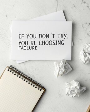 Motivational message on a sheet of paper emphasizing that not attempting something is a choice to fail serving as a reminder for personal development and perseverance