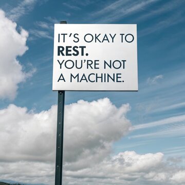 A motivational sign reminding us that it's okay to rest and take a break emphasizing the importance of self care in a busy world filled with constant demands.