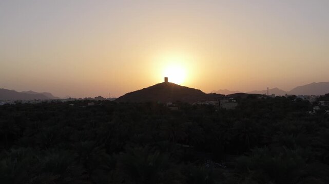 Aerial view of Birkat Al Mouz watchtower at sunset, Oman.