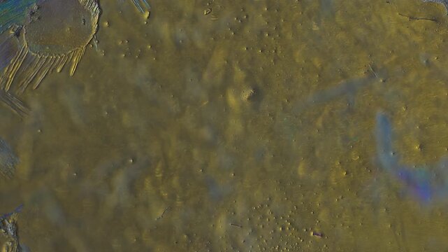Real time 5x microscope macro of explosive crystal growth with copy space under polarized light