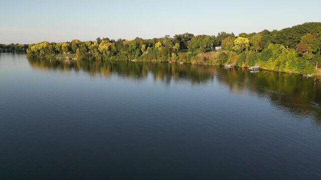 Aerial over Lake Chapin, a lake along the St. Joseph's River. Near Berrien Springs, Oronoko Charter Township, Michigan. A rural community with farms and lakeside / riverside homes.