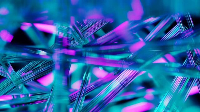 Tracking shot sweeping through entangled glass strands in macro close up with teal and magenta studio lighting