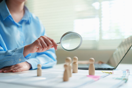 Compliance officer analyzing corporate personnel records and internal investigations at a modern office workstation, fraud prevention, line-by-line verification, AML compliance, and legal diligence