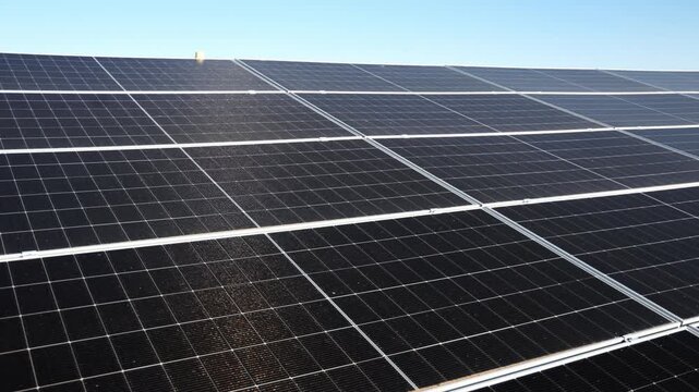 Rows of photovoltaic panels for solar electricity generation. Modern green energy and energy efficiency system.