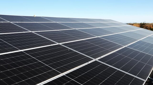 Photovoltaic modules installed in rows on a rooftop. Clean power, solar technology and green energy infrastructure concept.