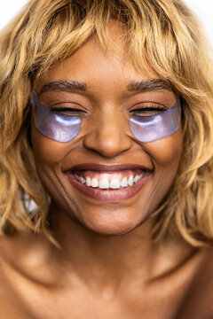 Woman Smiling With Eye Patches