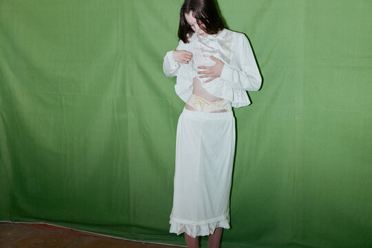 Fashion portrait woman green background