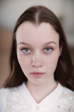 Closeup Natural Beauty Portrait Woman With Freckles Looking at Camera