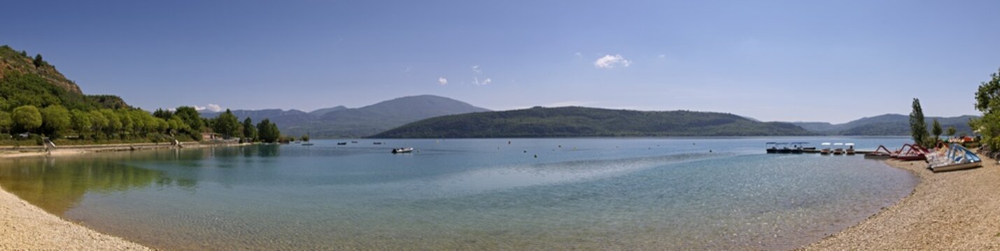 Turquoise Lake Shore of Lac de Sainte Croix with Mountains in Provence