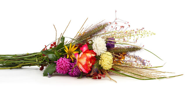 Colorful bouquet of wild autumn flowers isolated on a white background.
