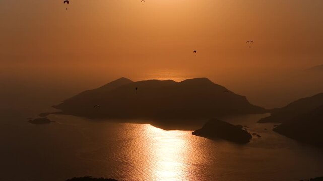 Fethiye Oludeniz Paragliding Drone Video, Fethiye Paragliding in the Sunset Time Drone Video, Kumburnu Beach Oludeniz, Fethiye Mugla, Turkiye (Turkey)