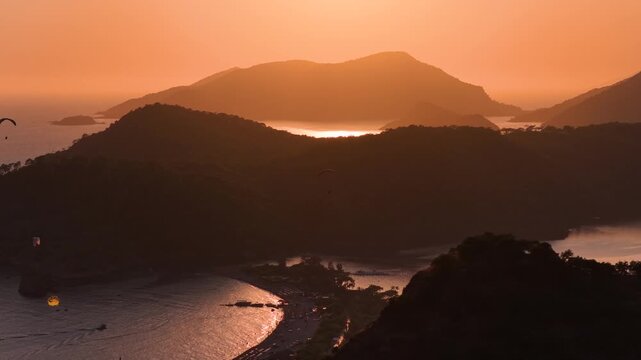 Fethiye Oludeniz Paragliding Drone Video, Fethiye Paragliding in the Sunset Time Drone Video, Kumburnu Beach Oludeniz, Fethiye Mugla, Turkiye (Turkey)