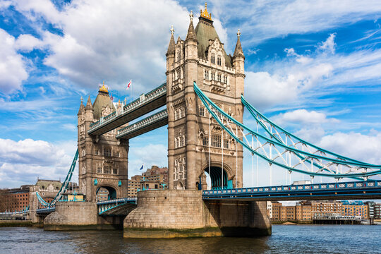 Tower Bridge over the River Thames, London, UK, iconic Victorian bascule and suspension bridge framed by sky and city skyline, England, Europe
