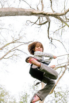 Girl Swinging in Fall Season