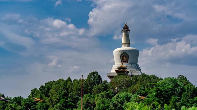White Dagoba Pagoda on Lush Hill in Beihai Park, Beijing, China Under Blue Sky