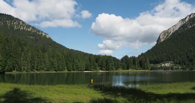 Bavarian lake landscape. Lake Spitzingsee between the alpine slopes of the Brecherspitz and J&auml;gerkamp, ​​seen from the western shore
