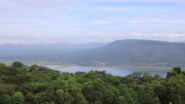 A scenic video view from the high-altitude wind turbine viewpoint at Khao Yai Thiang, Korat, Thailand, featuring beautiful scenery that overlooks the Lam Takhong Dam and wind energy infrastructure.