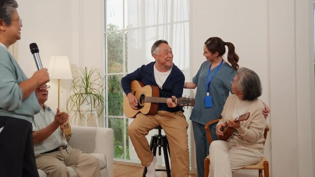 Senior retirement lifestyle elderly people sing, play guitar and ukulele in cheerful indoor group music session with care home support and bright social activity