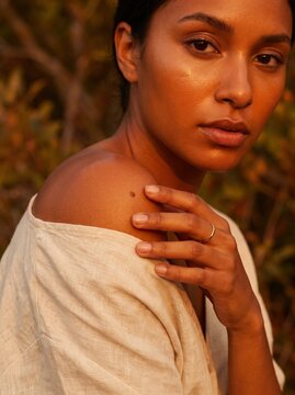 Luxury beauty shot of woman's skin at golden hour self mole check