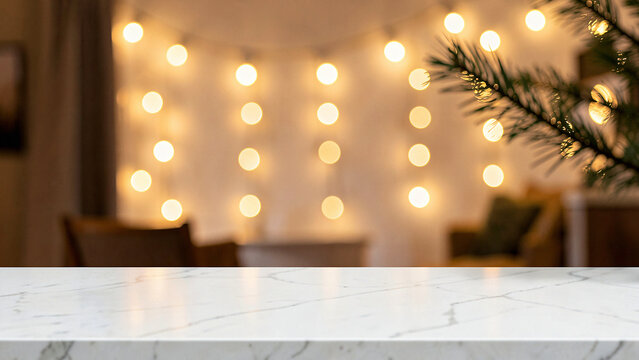 Marble tabletop featuring a white marble counter completely empty before string lights