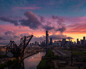 Chicago skyline and raised railway bridge at sunset © Ionel