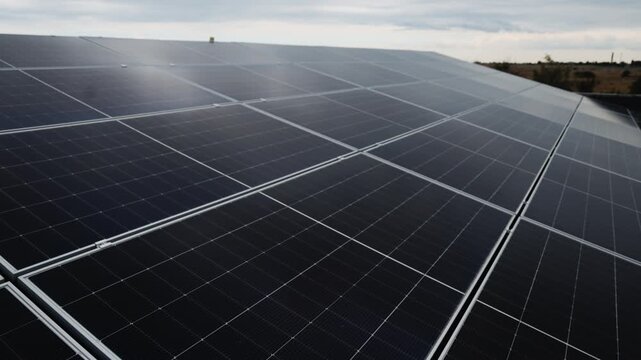 Geometric pattern of solar panels creates a stylish background for renewable energy, sustainability and modern infrastructure topics.