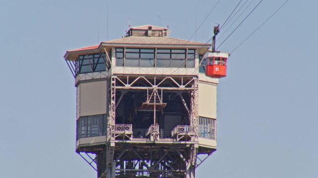 cable car and tower in barcelona with clear sky