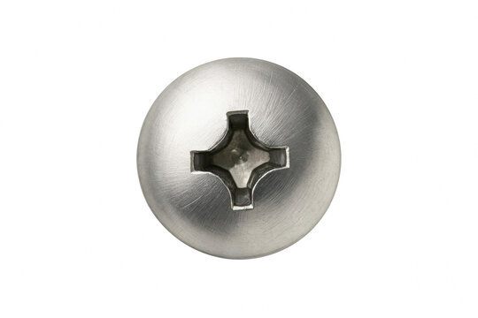 Macro view of a circular metal screw head with a cross recess
