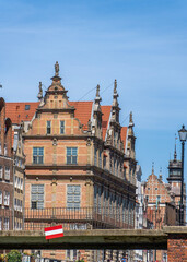 Obraz premium GDANSK, POLAND - JULY, 2026: Green Gate facades framed by bridge structure