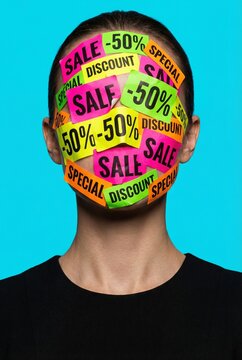 Consumerism Concept with Woman Covered in Sale Discount Stickers