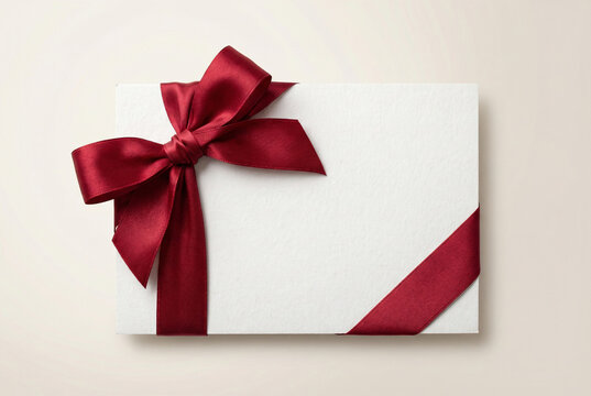 Blank Greeting Card With Red Ribbon Bow On Light Background