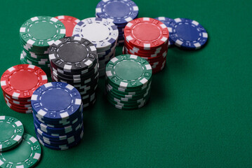 Obraz premium Multi colored gaming chips for betting in casino games. Betting chips