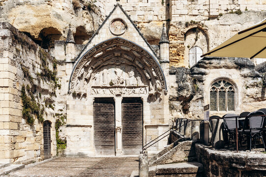 Saint Emilion, France - July 13, 2026: Gothic portal of the Monolithic Church, a medieval rock cut landmark in the historic center