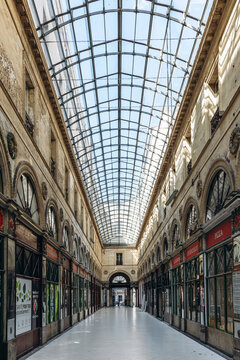 Bordeaux, France - July 14, 2026: Historic Galerie Bordelaise shopping arcade with ornate entrances, arcades and glass-roofed passage in central Bordeaux